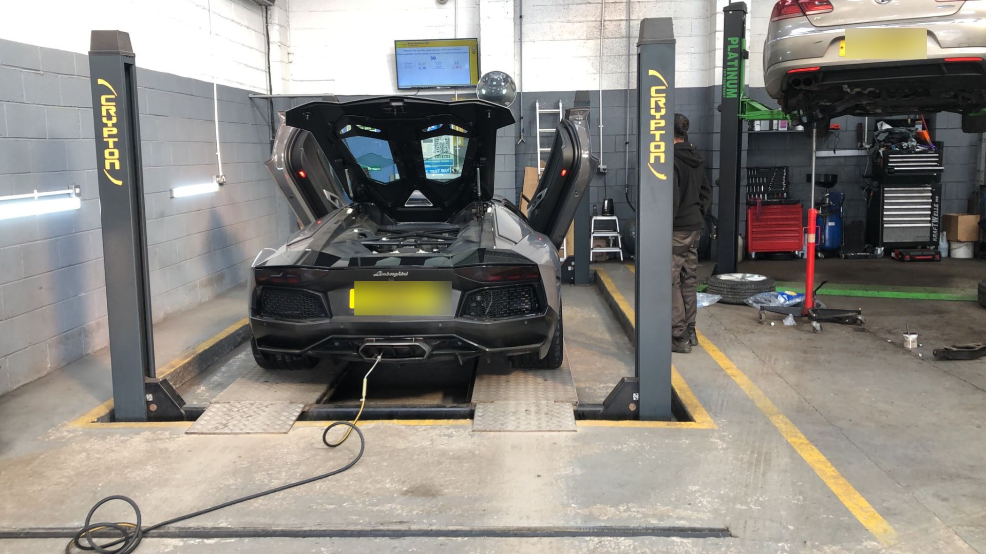 Lamborghini Aventador on the four-post MOT test bay at Autoworks Bradford